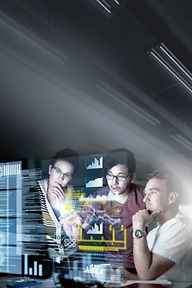 IT campaign motive - IT key visual. Three people behind screens showing