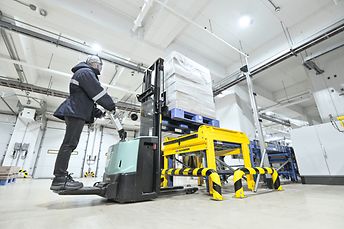 Pallets are being loaded into the infeed conveyor