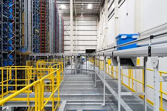 Inbound tote on the upper tier of conveying system to the allocated slot.