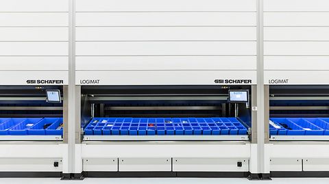 Three persons work on the six SSI LOGIMAT Vertical Lift Modules