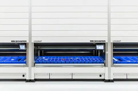 Three persons work on the six SSI LOGIMAT Vertical Lift Modules