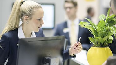 information stand at fair, Woman checks business card