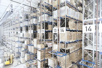 Pallet rack with cartons on euro pallets